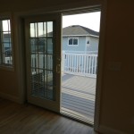 Sliding Glass Door to Open Sun Deck in 8 Sandpiper Ct Cape Shores Vacation Home